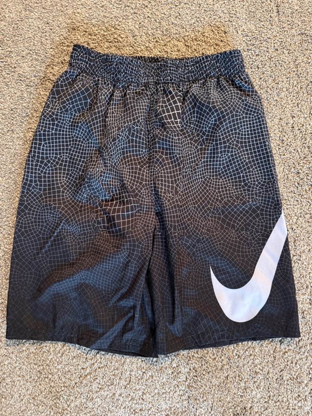 Nike Black Swim Shorts with White Swoosh and Grid Pattern